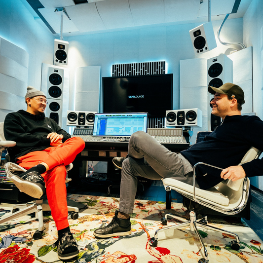 Two people talking in the Atmos room at GLAB Seoul