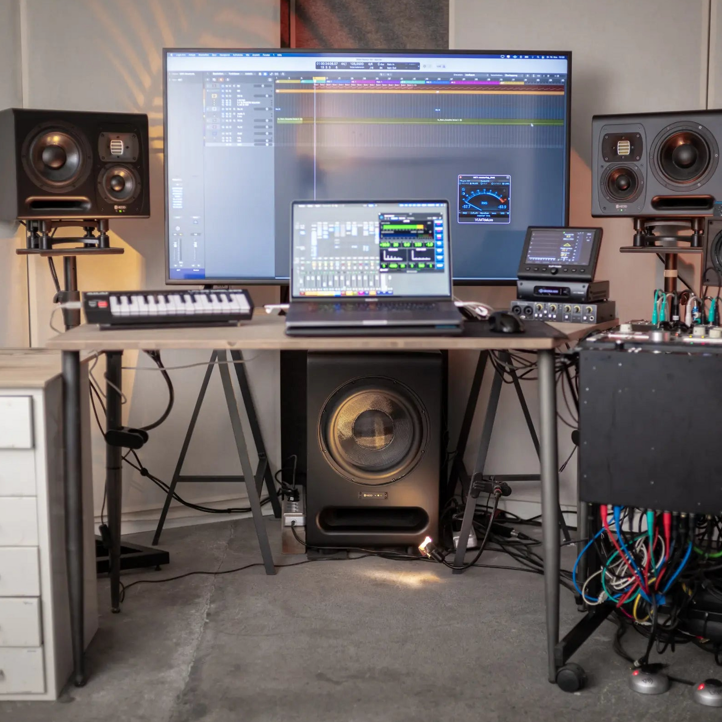 A home studio featuring HEDD monitors and subwoofer