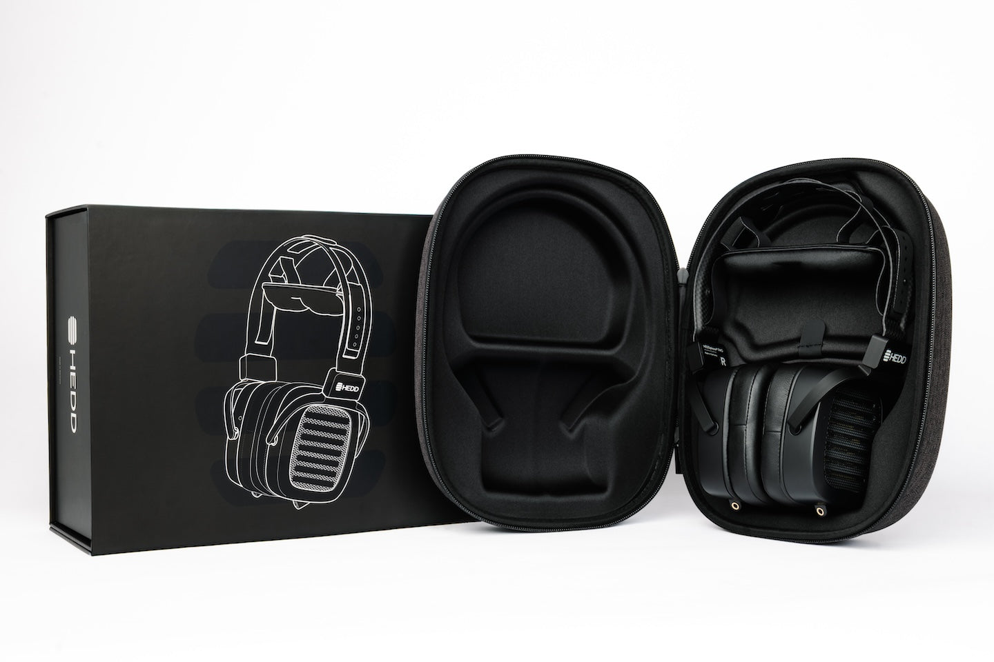 HEDDphone TWO in a protective case with packaging on a white background