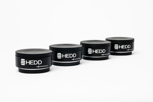 HEDD branded mini ISOPuck on a white background