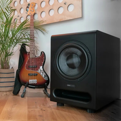 HEDD BASS 12 subwoofer next to a guitar