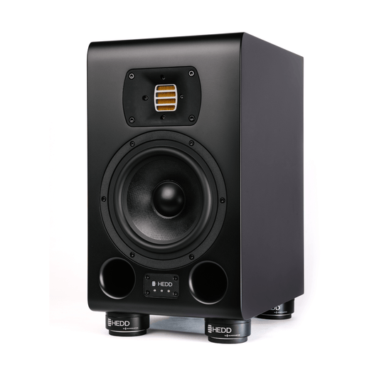 Black HEDD TYPE 07 ACORE monitor speaker on a white background with ISO pucks for isolation