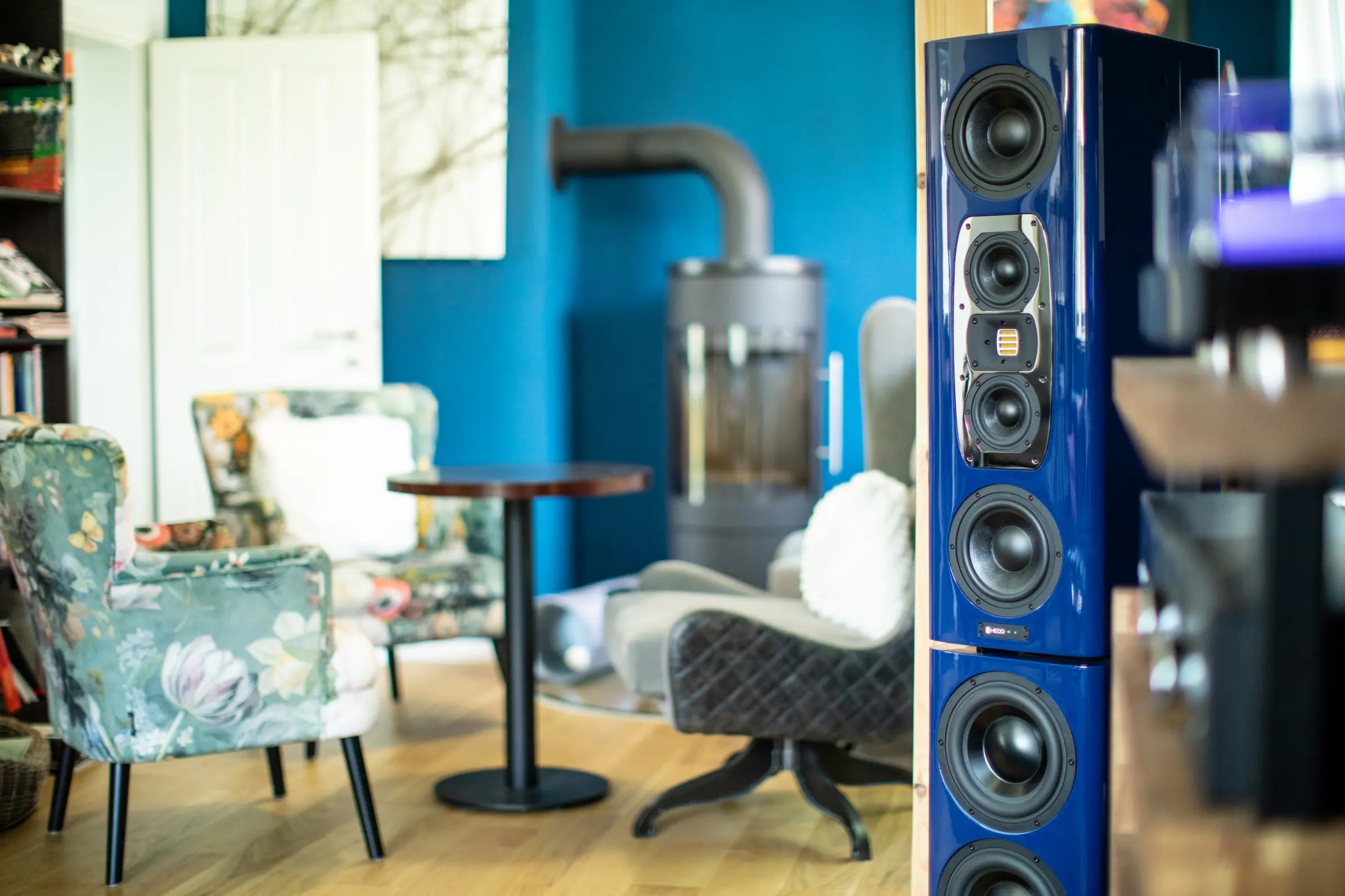 Custom blue HEDD tower mains in a home setting