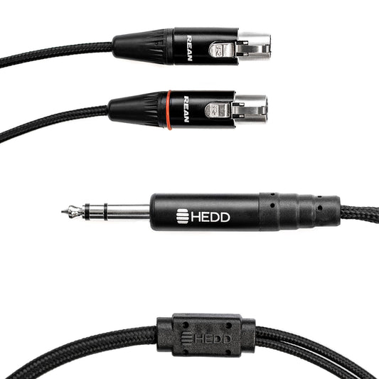 A black HEDDphone cable with a 3.5 mm headphone connector on one end and an XLR connector on the other.